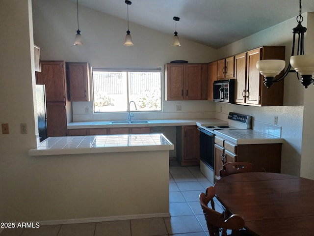 kitchen with sink, white electric range oven, tile counters, light tile patterned flooring, and decorative light fixtures