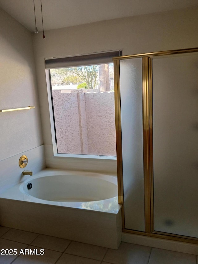 bathroom featuring independent shower and bath and tile patterned floors