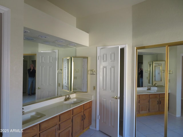 bathroom with tile patterned floors and vanity