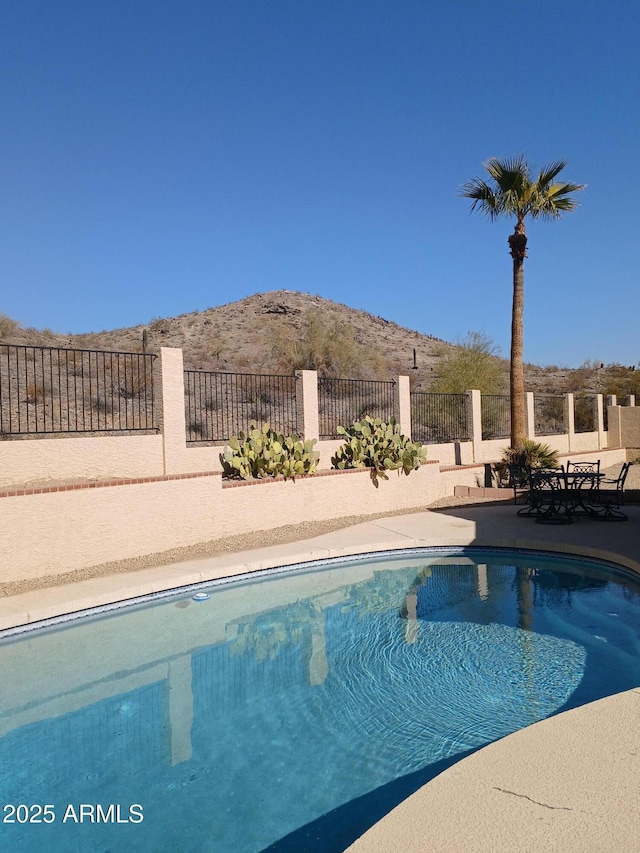 view of pool featuring a mountain view