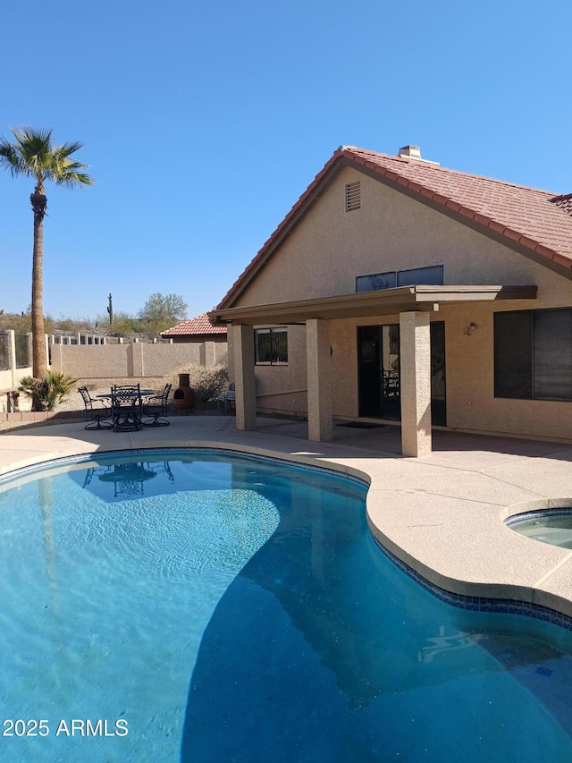 view of swimming pool featuring a patio