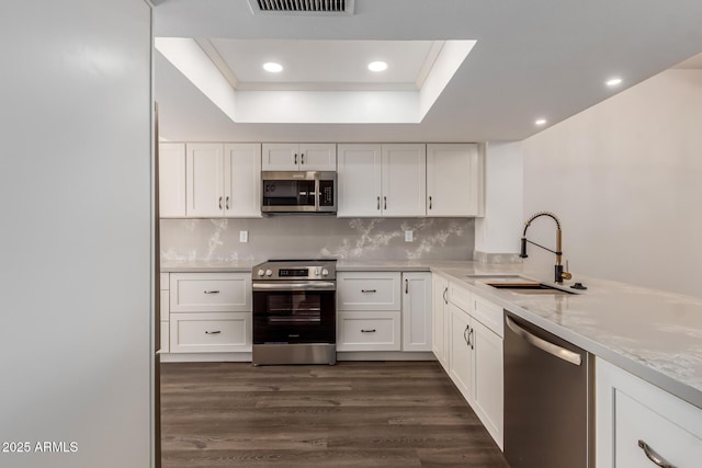 kitchen featuring white cabinetry, appliances with stainless steel finishes, and sink