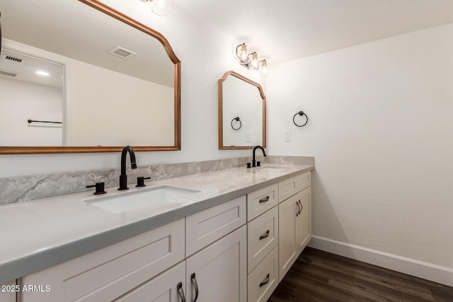 bathroom featuring vanity and wood-type flooring