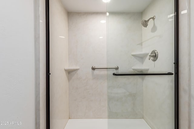 bathroom with a shower with shower door