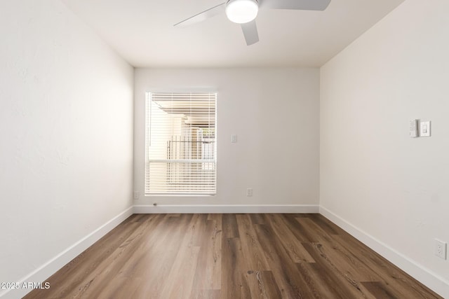 unfurnished room with ceiling fan and hardwood / wood-style floors