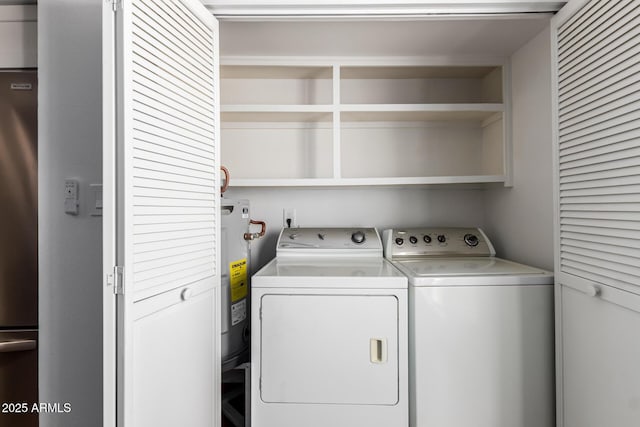 washroom featuring washer and dryer