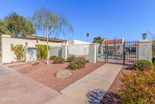 view of front of home featuring a fenced in pool