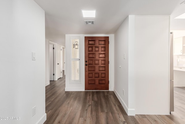 entryway with dark wood-type flooring