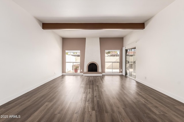 unfurnished living room with a fireplace, dark hardwood / wood-style floors, and beamed ceiling