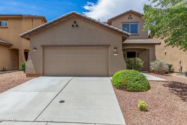 4151 Big Bend St, Sierra Vista, AZ 85650 - mediterranean / spanish-style house with a garage, stucco siding, a tiled roof, and concrete driveway