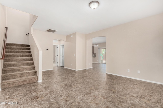 4151 Big Bend St, Sierra Vista, AZ 85650 - unfurnished living room with arched walkways, stairway, and baseboards