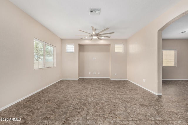 4151 Big Bend St, Sierra Vista, AZ 85650 - empty room featuring ceiling fan, arched walkways, baseboards, and tile patterned floors