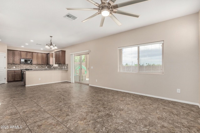 4151 Big Bend St, Sierra Vista, AZ 85650 - unfurnished living room featuring a chandelier, ceiling fan, recessed lighting, and baseboards