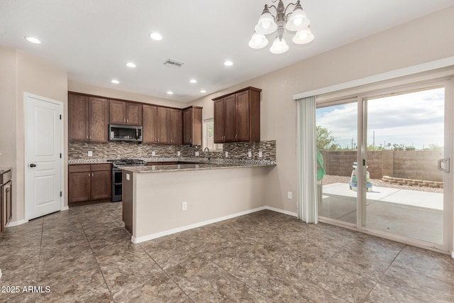 4151 Big Bend St, Sierra Vista, AZ 85650 - kitchen featuring appliances with stainless steel finishes, backsplash, a chandelier, a peninsula, and recessed lighting