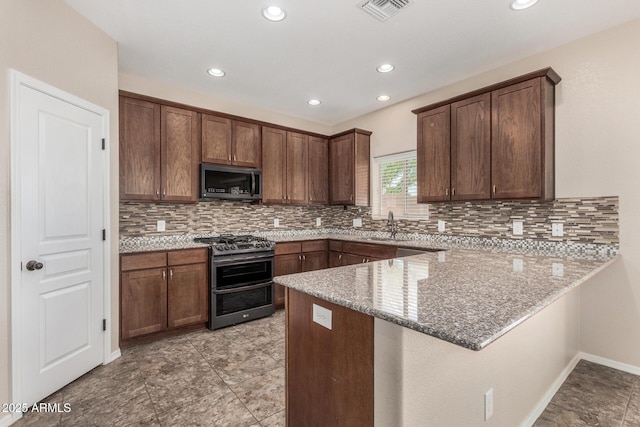 4151 Big Bend St, Sierra Vista, AZ 85650 - kitchen with appliances with stainless steel finishes, a peninsula, light stone counters, decorative backsplash, and recessed lighting