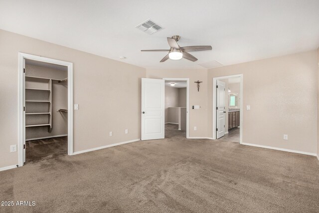 4151 Big Bend St, Sierra Vista, AZ 85650 - unfurnished bedroom with a walk in closet, carpet, and baseboards