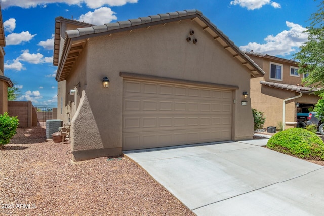 4151 Big Bend St, Sierra Vista, AZ 85650 - view of front of property with central AC, stucco siding, concrete driveway, a tiled roof, and fence