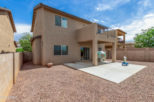 4151 Big Bend St, Sierra Vista, AZ 85650 - rear view of house featuring a balcony, a fenced backyard, a patio, and stucco siding