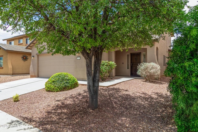 4151 Big Bend St, Sierra Vista, AZ 85650 - obstructed view of property featuring stucco siding, a garage, and driveway