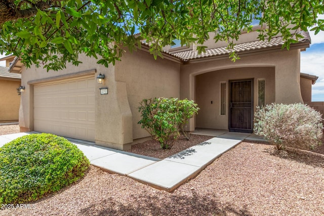4151 Big Bend St, Sierra Vista, AZ 85650 - entrance to property with stucco siding, a garage, and a tile roof