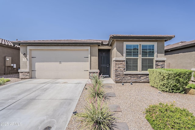 6566 E Via Arroyo Largo, Tucson, AZ 85756 - view of front of house with stone siding, stucco siding, an attached garage, concrete driveway, and a tile roof