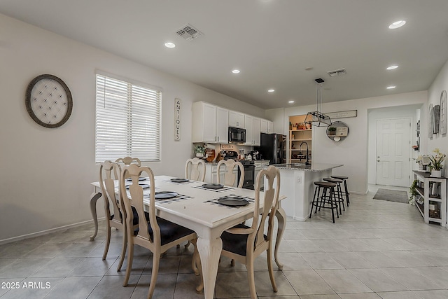 6566 E Via Arroyo Largo, Tucson, AZ 85756 - dining area with light tile patterned flooring and recessed lighting