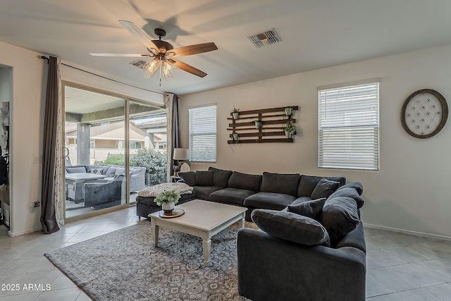 6566 E Via Arroyo Largo, Tucson, AZ 85756 - living room featuring light tile patterned floors and a ceiling fan