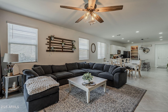 6566 E Via Arroyo Largo, Tucson, AZ 85756 - living area with light tile patterned floors, plenty of natural light, recessed lighting, and ceiling fan