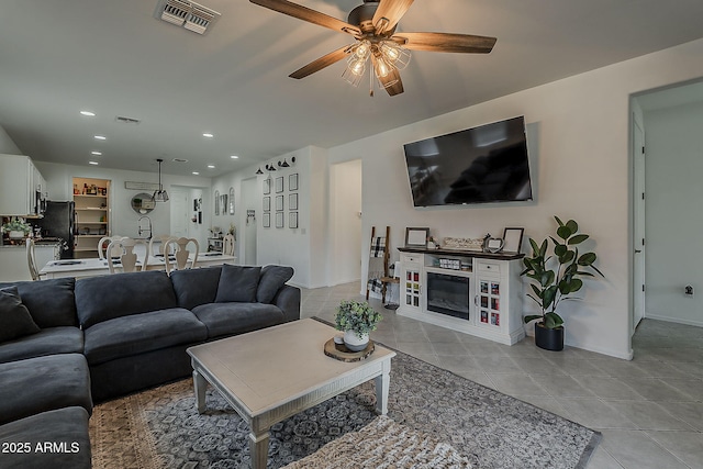 6566 E Via Arroyo Largo, Tucson, AZ 85756 - living area featuring ceiling fan, light tile patterned floors, and recessed lighting