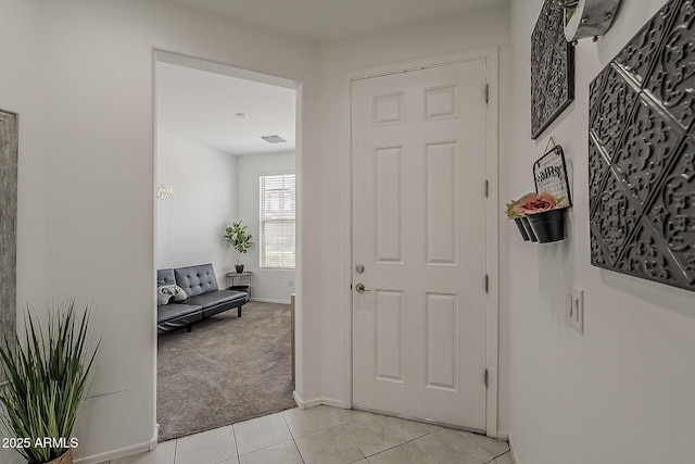 6566 E Via Arroyo Largo, Tucson, AZ 85756 - foyer entrance with light tile patterned floors and light colored carpet