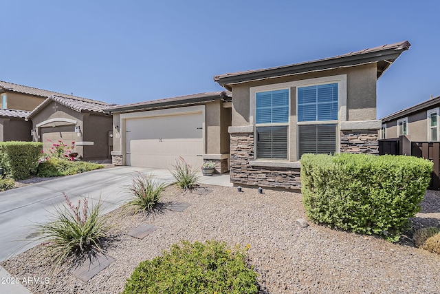 6566 E Via Arroyo Largo, Tucson, AZ 85756 - view of front of property featuring stone siding, stucco siding, concrete driveway, and an attached garage