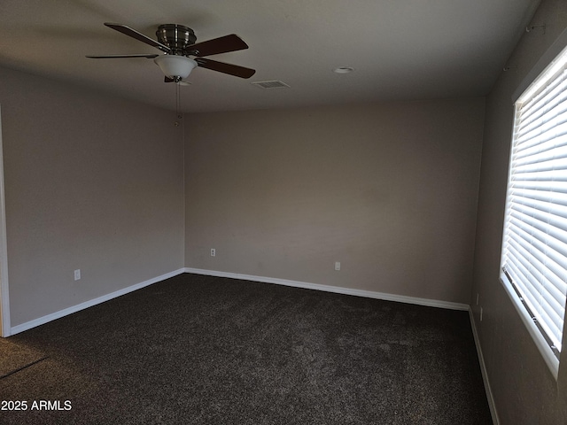 carpeted empty room featuring ceiling fan