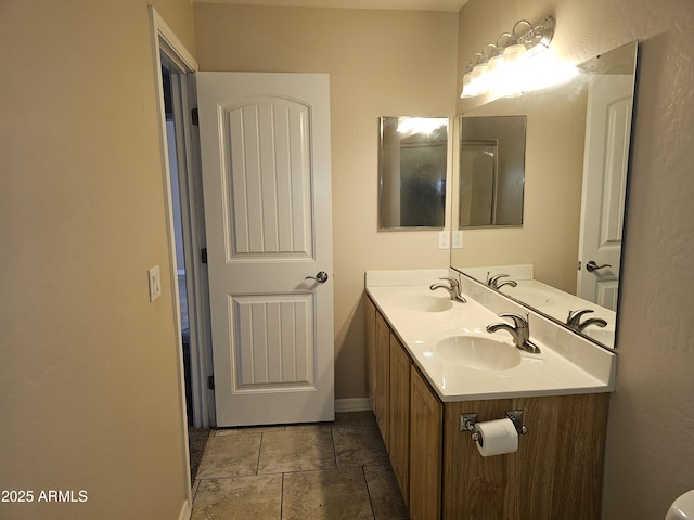 bathroom featuring tile patterned flooring and vanity