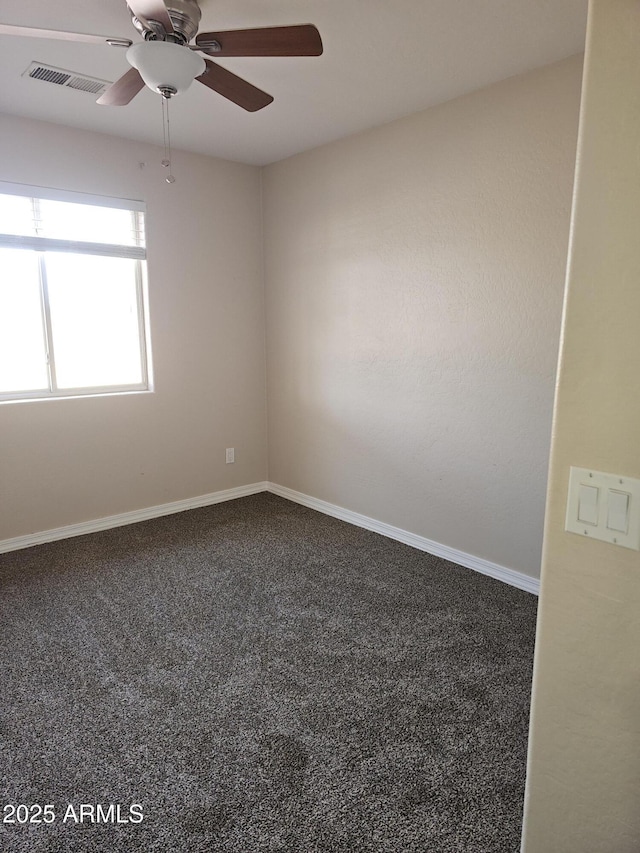 unfurnished room featuring carpet floors and ceiling fan