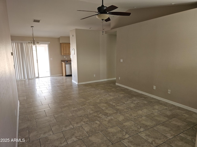 unfurnished room featuring lofted ceiling and ceiling fan with notable chandelier