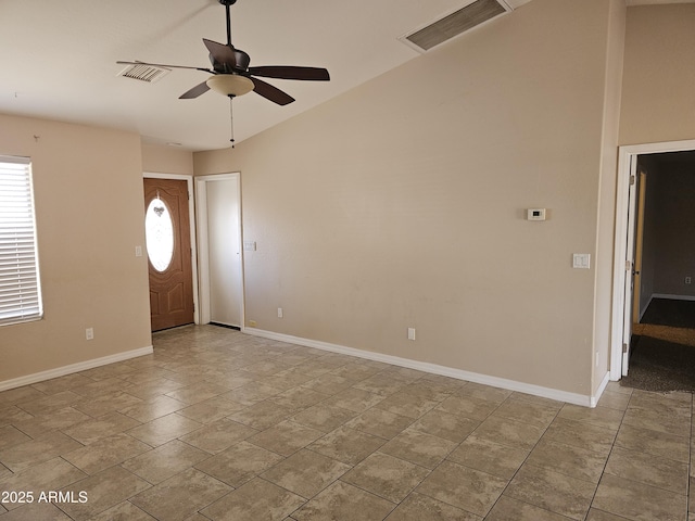 foyer featuring light tile patterned flooring and ceiling fan