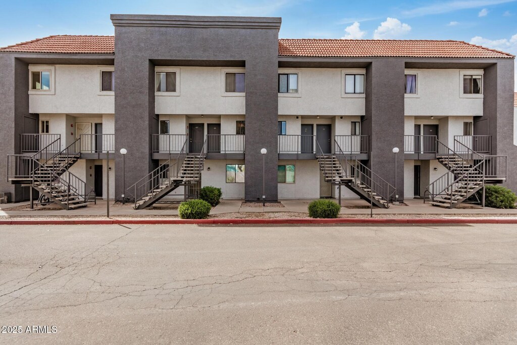 view of property featuring stairway