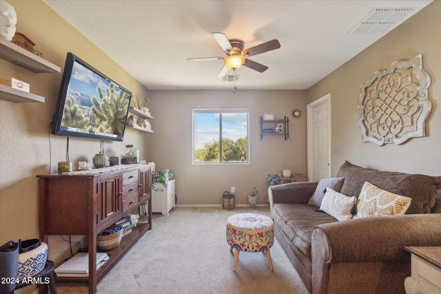 living room featuring light carpet and ceiling fan