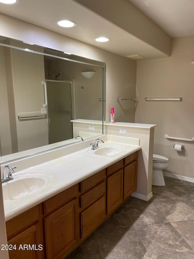 5830 E Mckellips Rd Unit 62, Mesa, AZ 85215 - bathroom with a sink, a stall shower, toilet, and double vanity