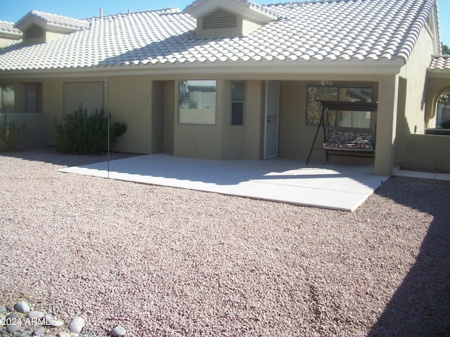 rear view of house featuring a patio area