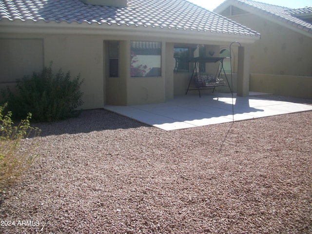 back of house with a patio area