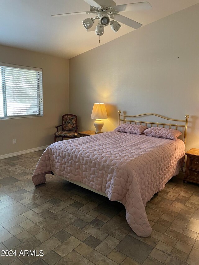 5830 E Mckellips Rd Unit 62, Mesa, AZ 85215 - bedroom featuring baseboards, ceiling fan, and stone tile flooring