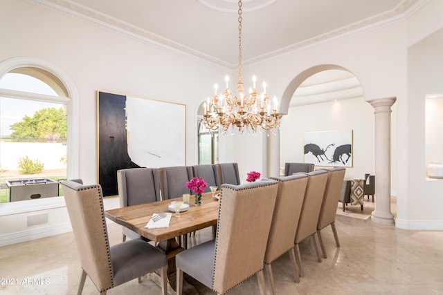 dining area with ornate columns and ornamental molding