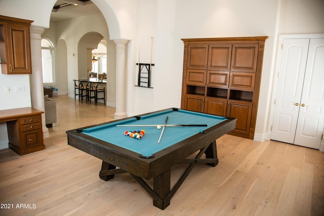 playroom featuring pool table, decorative columns, and light hardwood / wood-style flooring