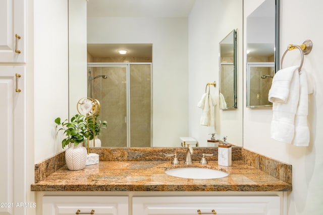 bathroom featuring vanity and walk in shower