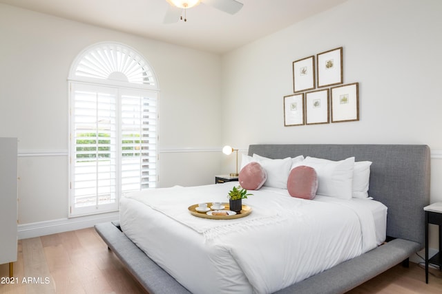 bedroom featuring hardwood / wood-style floors and ceiling fan