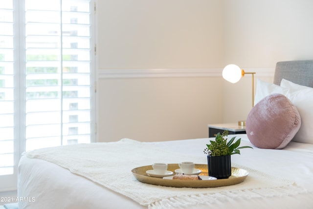 bedroom featuring multiple windows