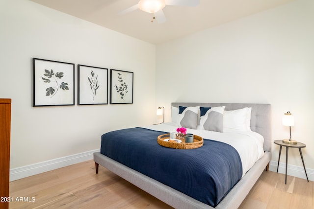 bedroom with wood-type flooring and ceiling fan