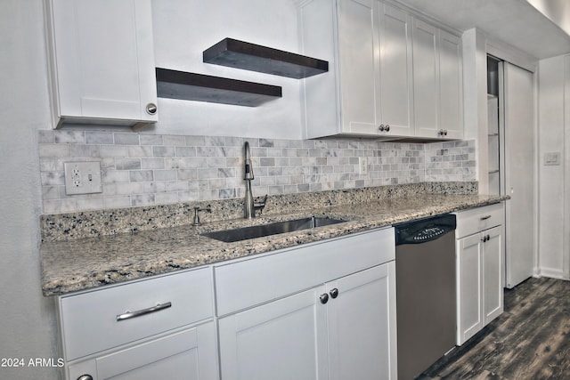 kitchen featuring dark hardwood / wood-style flooring, white cabinetry, backsplash, and dishwasher