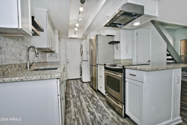 kitchen with rail lighting, wall chimney exhaust hood, dark hardwood / wood-style floors, electric range, and white cabinets